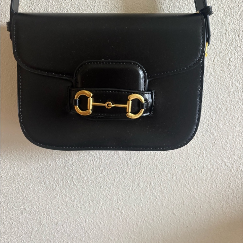 Sleek Black Crossbody Bag with Gold Hardware